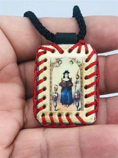 gucci escapulario santo niño de atocha